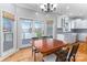 Dining area with wood table and chairs, overlooking waterfront view at 170 W Maranta Rd, Mooresville, NC 28117