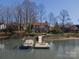 Scenic waterfront home with a private boat dock and lush landscaping, perfect for watersports and lakeside relaxation at 170 W Maranta Rd, Mooresville, NC 28117