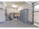 Garage featuring refrigerator, sink, storage, and an epoxy floor at 170 W Maranta Rd, Mooresville, NC 28117