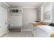 Functional laundry room with built in storage, bench and a convenient utility sink at 170 W Maranta Rd, Mooresville, NC 28117
