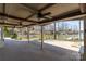 Expansive outdoor living space with ceiling fans offers views of the lake and boat docks at 170 W Maranta Rd, Mooresville, NC 28117