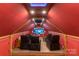 Home theater room featuring projector, screen, tiered seating, and starlit ceiling at 170 W Maranta Rd, Mooresville, NC 28117