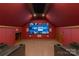 Home theater room featuring a large screen, comfortable seating, and atmospheric lighting at 170 W Maranta Rd, Mooresville, NC 28117