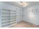 Spacious walk-in closet with custom shelving and ample storage for all your wardrobe needs at 170 W Maranta Rd, Mooresville, NC 28117