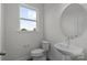 Bathroom featuring a modern toilet and a sink with a round mirror at 2013 Near Point Rd # 20, Charlotte, NC 28208