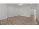 Neutral bedroom with wood-look floors, closet and recessed lighting, offering versatile space at 2013 Near Point Rd # 20, Charlotte, NC 28208