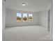 Spacious bedroom featuring carpeting and ample natural light from windows at 2013 Near Point Rd # 20, Charlotte, NC 28208