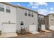 Row of new townhomes with two-car garages and neutral siding colors at 2013 Near Point Rd # 20, Charlotte, NC 28208