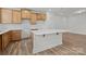 Modern kitchen features wooden cabinets, white countertops, and an island with a breakfast bar at 2013 Near Point Rd # 20, Charlotte, NC 28208