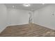 Bright living room featuring hardwood floors and staircase access at 2013 Near Point Rd # 20, Charlotte, NC 28208