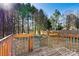 Wooden back deck overlooks private backyard with natural wood stain and a wooden fence at 2107 Summerfield Cir, Conover, NC 28613