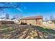 View of the home's backyard featuring a private wooden back deck and brick exterior at 2107 Summerfield Cir, Conover, NC 28613