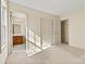 Primary bedroom features neutral walls, carpet and closet at 2107 Summerfield Cir, Conover, NC 28613