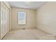 Bedroom featuring a large window and closet at 2107 Summerfield Cir, Conover, NC 28613