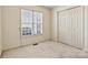 Bedroom featuring a window with blinds and closet at 2107 Summerfield Cir, Conover, NC 28613