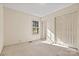Bright bedroom featuring a large window and closet at 2107 Summerfield Cir, Conover, NC 28613