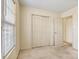 Bedroom featuring a window with blinds and closet at 2107 Summerfield Cir, Conover, NC 28613