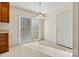 Bright dining area with access to the backyard and a view of the kitchen at 2107 Summerfield Cir, Conover, NC 28613