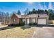 Inviting single-story brick home featuring green shutters and a lush front yard at 2107 Summerfield Cir, Conover, NC 28613