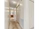 Hallway with neutral walls and carpet leading to a bathroom at 2107 Summerfield Cir, Conover, NC 28613