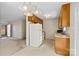 Bright kitchen features vintage cabinets, laminate countertops and updated white appliances at 2107 Summerfield Cir, Conover, NC 28613