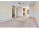 Spacious living room featuring neutral carpet and easy access to other areas of the home at 2107 Summerfield Cir, Conover, NC 28613