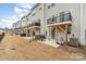 Backyard featuring patios, outdoor seating areas, and well-maintained grass at 2311 Doby Creek Ln, Charlotte, NC 28262