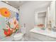 Bathroom with vanity, toilet, and shower/tub combination behind floral curtain at 2311 Doby Creek Ln, Charlotte, NC 28262