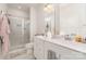 Modern bathroom with a glass-enclosed shower, a double vanity, and ample counter space for a luxurious experience at 2311 Doby Creek Ln, Charlotte, NC 28262