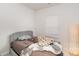 Bedroom with comfortable bed, plush headboard and modern window shade at 2311 Doby Creek Ln, Charlotte, NC 28262