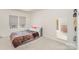 Cozy bedroom features a comfortable bed, a window with blinds, and ample natural light, creating a serene retreat at 2311 Doby Creek Ln, Charlotte, NC 28262