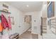 Welcoming hallway with coat hooks, bench, and stylish staircase at 2311 Doby Creek Ln, Charlotte, NC 28262