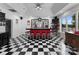 Finished basement bar with seating for six, a lake view, and checkered tile at 249 Blue Heron Dr, Rock Hill, SC 29732