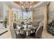 Upscale dining area boasts ornate table, seating, chandelier, murals, and large windows at 249 Blue Heron Dr, Rock Hill, SC 29732
