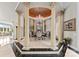 Luxurious dining room with ornate columns, chandelier, wall mural and seating for six guests at 249 Blue Heron Dr, Rock Hill, SC 29732