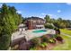 Expansive brick home with a luxurious backyard pool and meticulously landscaped garden at 249 Blue Heron Dr, Rock Hill, SC 29732