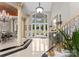Elegant foyer featuring marble floors, soaring ceilings, decorative columns, and a grand staircase at 249 Blue Heron Dr, Rock Hill, SC 29732