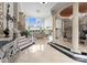 Elegant foyer featuring marble floors, staircase, chandelier, and decorative columns at 249 Blue Heron Dr, Rock Hill, SC 29732