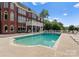 Backyard with a large in-ground swimming pool and brick home at 249 Blue Heron Dr, Rock Hill, SC 29732
