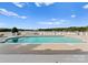 Serene pool overlooking the lake, surrounded by lounge chairs and lush greenery at 249 Blue Heron Dr, Rock Hill, SC 29732