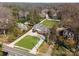 Expansive aerial view of a beautiful home with a large, well-maintained lawn and mature trees at 2701 Sharon Rd, Charlotte, NC 28211