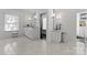 Spacious bathroom with double vanity, marble floors, and ample counter space at 2701 Sharon Rd, Charlotte, NC 28211
