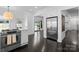 Modern kitchen featuring stainless steel appliances and dark hardwood floors at 2701 Sharon Rd, Charlotte, NC 28211