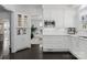 Bright kitchen with stainless steel appliances and custom white cabinetry at 2701 Sharon Rd, Charlotte, NC 28211