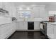 Well-lit kitchen featuring classic white cabinets and modern appliances at 2701 Sharon Rd, Charlotte, NC 28211
