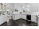 Charming kitchen featuring classic white cabinets and dark hardwood floors at 2701 Sharon Rd, Charlotte, NC 28211