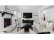 Spacious living room with a fireplace, sleek furniture, and modern decor under ample lighting at 2701 Sharon Rd, Charlotte, NC 28211