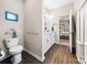 Bright bathroom with double vanity, toilet, and doorway to bedroom, stylishly designed at 2914 Hiddenbrook Way, Indian Land, SC 29707