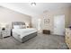 Comfortable bedroom featuring a bed and bedside table, providing a cozy and inviting space at 2914 Hiddenbrook Way, Indian Land, SC 29707