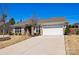 A single story brick home with a two car garage and a well maintained lawn in front of the property at 2914 Hiddenbrook Way, Indian Land, SC 29707